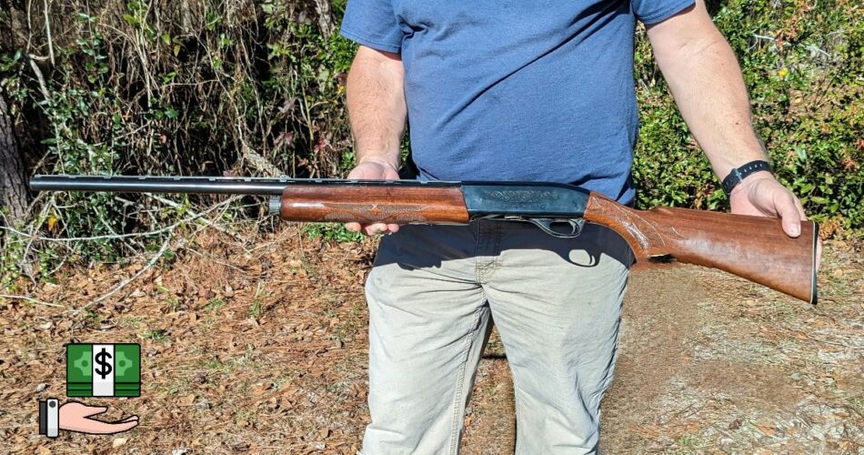 A man holding a 12-gauge shotgun